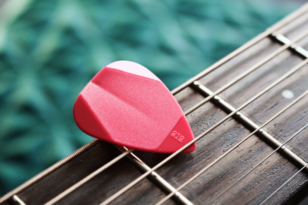guitar pick on a guitar string